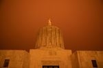 Wildfire smoke turns the sky orange at the Oregon Capitol in Salem, Ore., Sept. 8, 2020. 