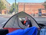 Jim Robinson has camped on Northwest 6th and Davis for one month. Robinson says he has $2.75 to his name and would not be able to afford a fine if living outside became a criminal offense in Portland.