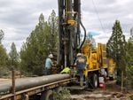 Drillers work to bore a domestic well at a new rural home site about 10 miles east of Bend, Oregon. July 5, 2022.