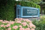 A sign marks the entrance to Willamette University in Salem, Ore., Wednesday, Aug. 7, 2019. California students used to bolster the student body at the school.