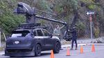A film crew shoots a car commercial.