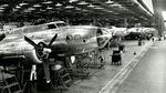 A row of B-17 bombers being assembled by Boeing workers at a Seattle plant during World War II.