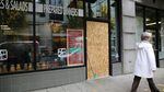 Boarded-up windows pepper NW Lovejoy Street in Portland on Nov. 11, 2016, where the night before vandals broke windows during what was a predominately peaceful protest.