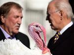President Joe Biden talks with Ronald Parker, Chairman of the National Turkey Federation, with Chocolate, the national Thanksgiving turkey, in foreground, at last November's pardoning.