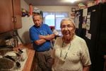 Arlita Rhoan, right, and Lyle Rhoan stand in their kitchen on the Warm Springs Reservation on Thursday, March 28, 2019, in Warm Springs, Ore.
