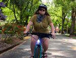Oregon State University doctoral candidate Kailey Kornhauser rides through the Corvallis campus.