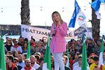 Giorgia Meloni, leader of Italian far-right party Fratelli d'Italia (Brothers of Italy), flashes the victory sign as she delivers a speech at the Arenile di Bagnoli beachfront in Naples on Friday, closing her party's campaign for the Sept. 25 general election.