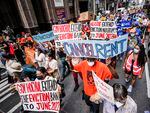 Housing activists march across town towards the office of New York Gov. Kathy Hochul. The state recently pledged to spend $800 million of its pandemic relief money on rental assistance.