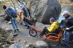 Navigating the trail with an AdvenChair rider requires problem solving and teamwork. 
