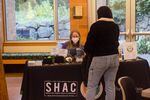 Grace Johnson, left, speaks with a student about what PSU's Center for Student Health and Counseling is offering at a tabling event on the university campus Wednesday, December 7, 2022.