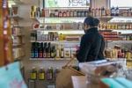 A customer shops at Wellspent Market in Portland. The delay in the store's olive oil delivery from Italy has delayed the launch of a distribution program that would put Wellspent’s olive oil in more local shops. 