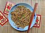 A bowl of ginger-scallion lo mein — longevity noodles for Lunar New Year