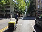Portland State University graduate research assistant Philip Orlando tests for diesel emissions in downtown Portland using a bike trailer full of measuring devices.
