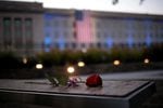 A rose rests on a bench at the Pentagon National September 11 Memorial, September 11, 2021, in Arlington, Virginia.