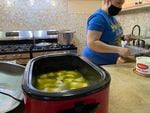 Natalia Nahurska prepares a crock pot of pierogies — a dumpling filled with meat or vegetables — for customers at the St. John the Baptist Ukrainian Orthodox Church in Portland.
