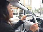 Ana Mendoza drives to a panel discussion in a shared electric car based at the Hacienda low-income housing community.