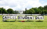 In June, borrower advocates erected signs in front of the White House calling on President Biden to cancel student debt.