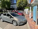 Electric vehicles line up at Downtown Portland's Electric Ave. The space offers EV drivers fast chargers for many different charging ports.