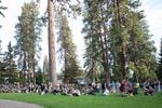 Hundreds gather at Drake Park in Bend, Ore., Monday, Aug. 29, 2022, for a vigil to honor victims of a shooting the day prior. A gunman opened fire at a Safeway in Bend on Sunday, killing two people.