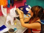 Yesenia Prieto, owner of Pinata Design Studio in LA, is working on a custom piñata.