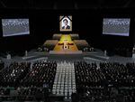 A portrait of Japan's former prime minister Shinzo Abe hangs above the stage during his state funeral in the Nippon Budokan Hall in Tokyo on Tuesday.