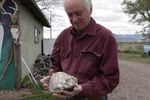 John Moreau holds a rock he just purchased.