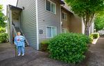 Heidi Johnstone, 61, outside the Woodspring Apartments in Tigard. The real estate investment company Hamilton Zanze announced in January that all of the 172-units will be brought to market rate within a few years. Now tenants have sued. 