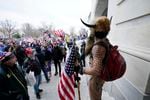 Trump supporters gather outside the Capitol, Wednesday, Jan. 6, 2021, in Washington. As Congress prepares to affirm President-elect Joe Biden's victory, thousands of people have gathered to show their support for President Donald Trump and his claims of election fraud.