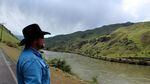Rancher Chad DelCurto stands at the banks of the Snake River, surveying the stretch of public land where his cattle graze. DelCurto said he lost 41 calves and 11 cows last year, and he blames wolves.