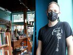 Rolland Walsh, pictured March 1, 2022, owns Black Ink Coffee on Main Street in Oregon City. He said the state's expiring indoor mask mandate has been difficult to enforce.