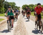 Marley Blonsky, left, leads a group ride during the 2021 Unbound Gravel event in Emporia, Kansas.