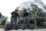 The Washington State Patrol said Tuesday that 74 commissioned officers — 67 troopers, six sergeants and one captain — were among those who left the agency due to the mandate.  Two Washington State Troopers stand guard at the Amazon Spheres on May Day, Tuesday, May 1, 2018, in Seattle. 