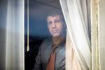 Joe Dibee is portrayed while looking out of a window at his family's home on Wednesday, February 17, 2021, in Seattle.