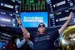 FILE: Dutch Bros Coffee co-founder and Executive Chairman Travis Boersma is shown ringing the ceremonial first trade bell on the floor of the New York Stock Exchange, as his company's IPO opens, Sept. 15, 2021.