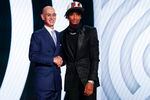 Shaedon Sharpe, right, shakes hands with NBA Commissioner Adam Silver after being selected seventh overall by the Portland Trail Blazers in the NBA basketball draft, Thursday, June 23, 2022, in New York.