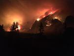 The Eagle Creek Fire swelled overnight Tuesday, burning more than 4,800 acres and threatening numerous structures along the Oregon side of the Columbia River Gorge.