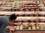 A man shops for meat at a grocery store in Annapolis, Md., on May 16 as Americans brace for summer sticker shock because of high inflation.