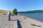 Kalama Mayor Mike Reuter walks on a beach on the lower Columbia River, July 29, 2021. The area on the left is the site of a proposed $2 billion plant that would convert fracked natural gas into methanol, but developers have since pulled out of the deal.