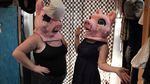 Helen's Pacific Costumers Manager Sally Newman, right, and her roommate, left, model two of the "Three Little Pigs" mascot heads.