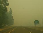 Smoke limits visibility on Interstate 5 near the Quines Creek Road exit, 12 miles south of Canyonville, Ore., July 27 2019. 