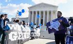Pro-abortion rights protesters and anti-abortion protesters rally outside the Supreme Court in Washington.