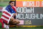 Gold medalist Sydney McLaughlin of the United States poses by a sign after winning the final of the women's 400-meter hurdles at the World Athletics Championships on Friday.