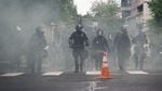 Portland police used tear gas and rubber bullets to disperse protesters from near the Justice Center an hour before the 8 p.m. curfew went into effect on May 30, 2020. The protests were against racist violence and police brutality in the wake of the killing of George Floyd by a white Minneapolis police officer.