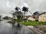 In this photo provided by the U.S. Coast Guard, downed tree branches litter a neighborhood in Yona, Guam, Thursday, May 25, 2023, after Typhoon Mawar passed over the island. The powerful typhoon smashed the U.S. territory of Guam and continued lashing the Pacific island with high winds and heavy rain Thursday, knocking down trees, walls and power lines and creating a powerful storm surge that threatened to wash out low-lying areas.