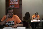 Volunteers for the Yes on 1639 campaign call voters to ask for their support in November on Sept. 15, 2018, in Vancouver, Washington. The campaign chairperson says the NRA has spent less money to defeat this initiative than in the past and as a result he's had an easier time reaching voters.