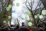Larnell Bruce Jr.'s family releases green balloons after the sentencing hearing of Russell Courtier on April 16, 2019, in Portland, Ore.