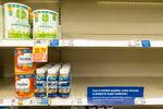 Baby formula is displayed on the shelves of a grocery store with a sign limiting purchases in Indianapolis on Tuesday.
