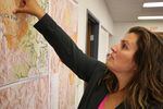 Josephine County Commissioner Lily Morgan points out containment lines on a wildfire threatening homes. 