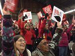 Opponents of the proposed Vancouver Energy terminal dressed in red and held a rally during a public hearing.