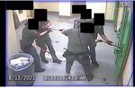 Five deputies use a tether to pull a restrained inmate as they leave his jail cell. The August 2021 incident - which included multiple uses of force - resulted in a criminal investigation led by an outside agency.